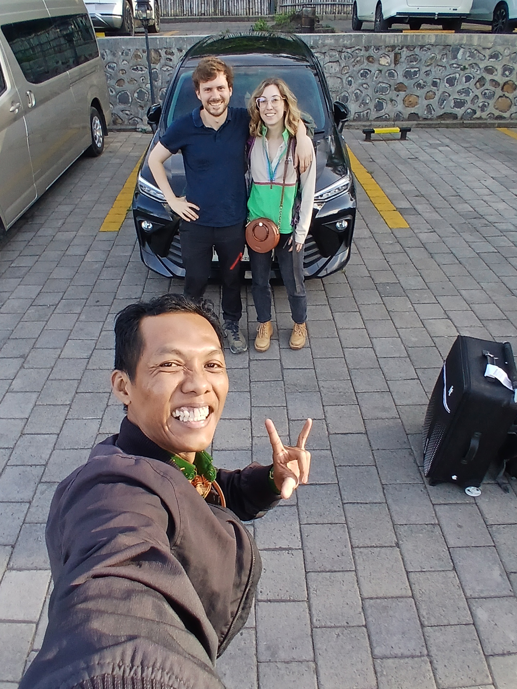 Scenic view of Kawah Ijen volcano at sunset with colorful sky and crater lake